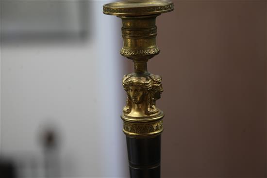 A pair of Empire style bronzed ormolu candlesticks, 10.5in.